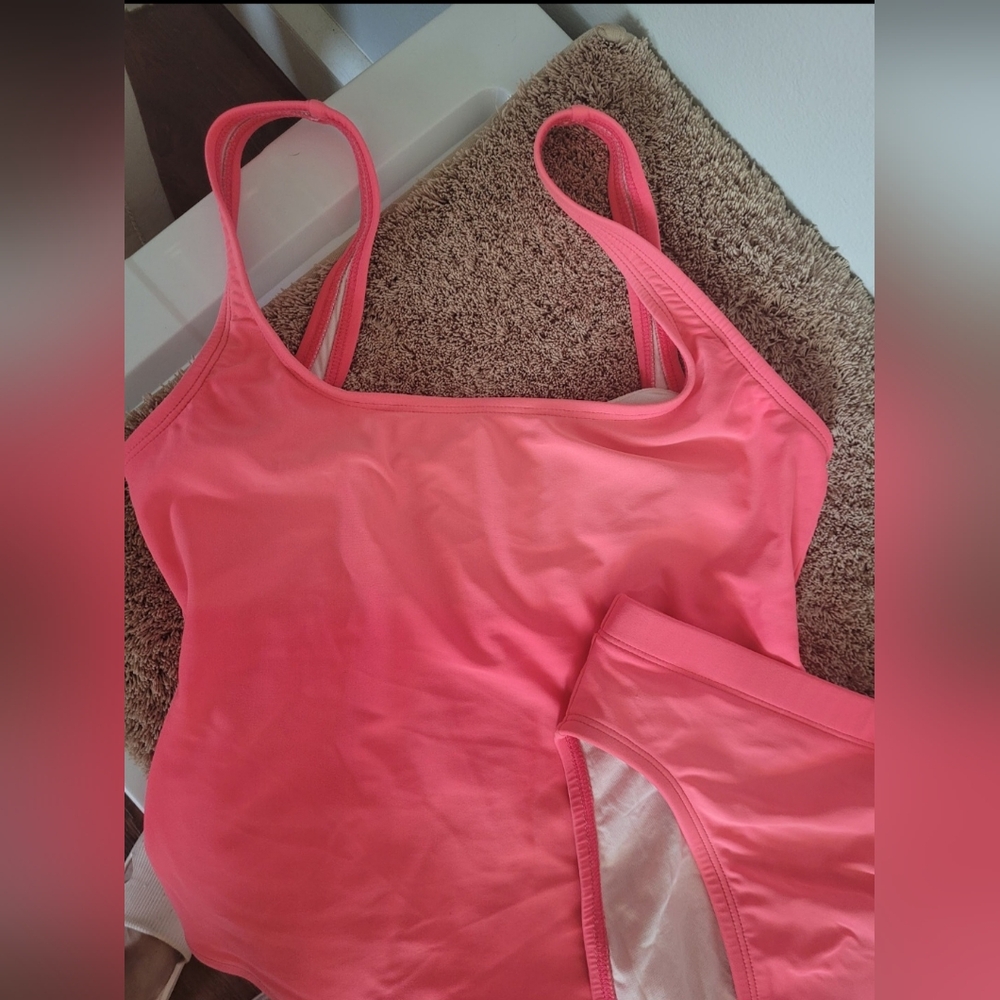 Two-piece swimsuit with a halterneck and bikini. Anne Cole brand. Neon pink.